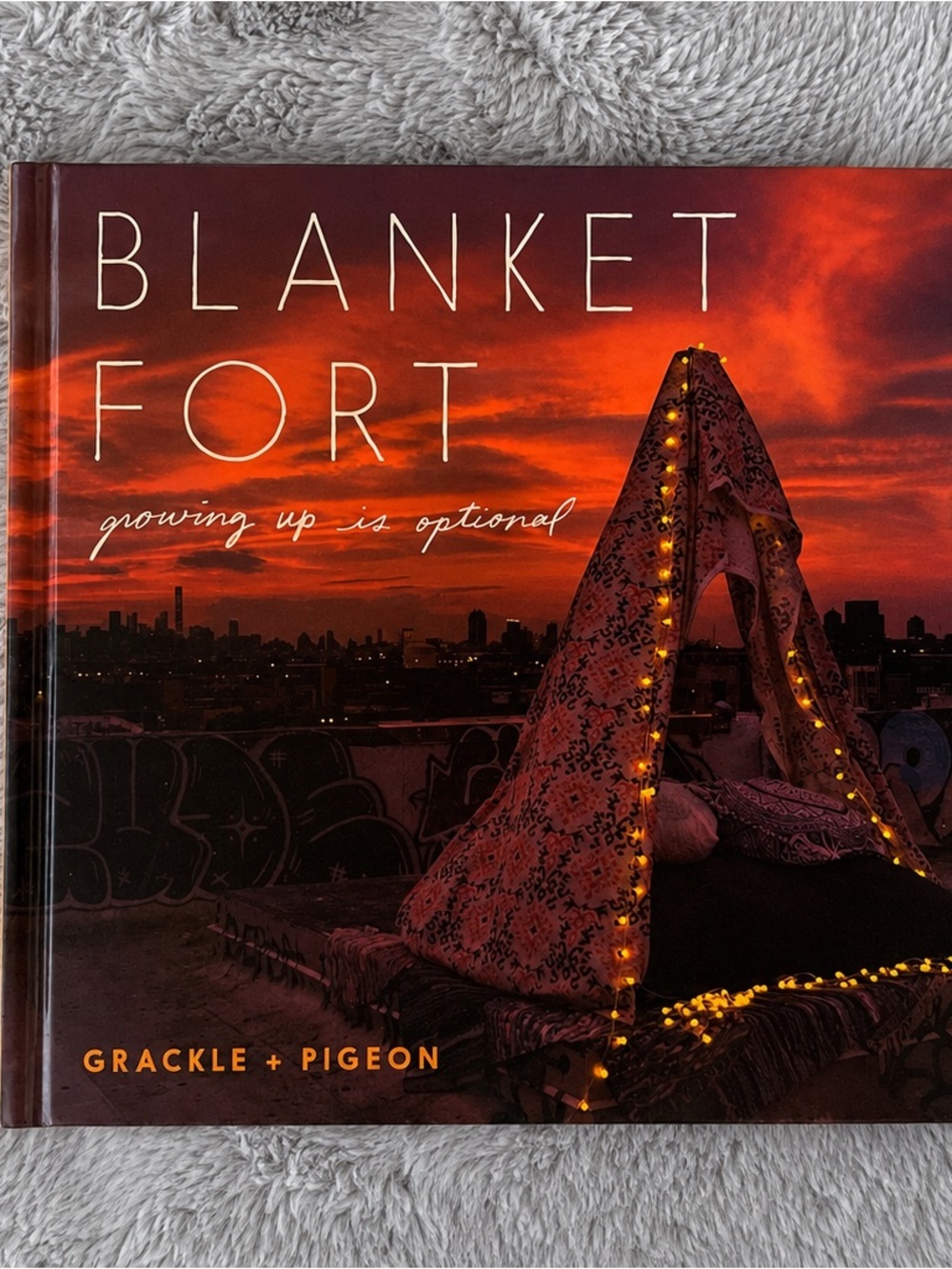 Blanket Fort: Growing Up Is Optional Hardcover Book Grackle + Pigeon​